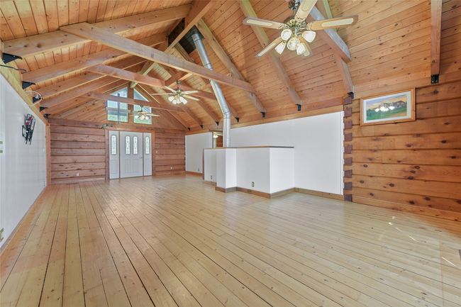 Red Cedar and Pine. Flue from Free Standing Fireplace on Lower Level. Ceiling Fans, and artists rendering of home. Without Virtual Staging. | Image 8