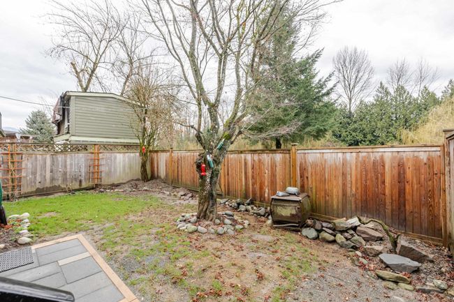 View of fenced backyard | Image 29