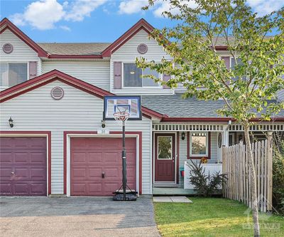 There is an inside entry from the garage, but having a covered porch at the front door is great for those wet or nasty winter days. | Image 1