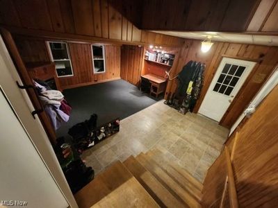 Living room with wood walls | Image 3