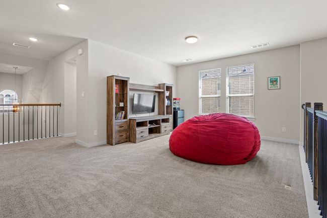 Living area featuring recessed lighting, carpet, visible vents, and baseboards | Image 26