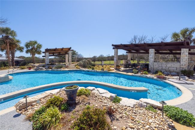Pool with a patio and a pergola | Image 24