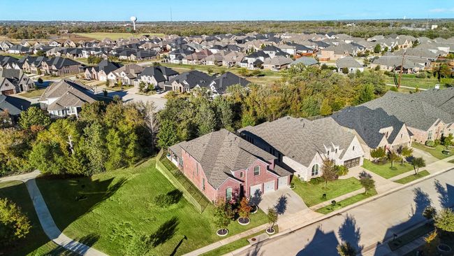 Aerial view of grass area and trail to the left of the home offering privacy! | Image 37