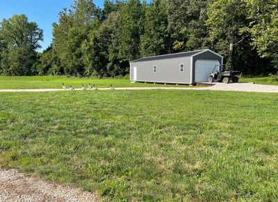 View of yard with an outdoor structure and a garage | Image 2