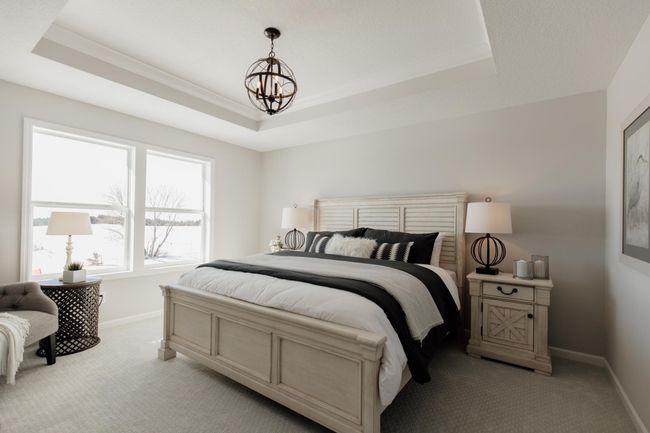 Primary Bedroom with Owner's Sanctuary Ensuite and Double Sided Walk-In Closet. *Photo of similar home | Image 12