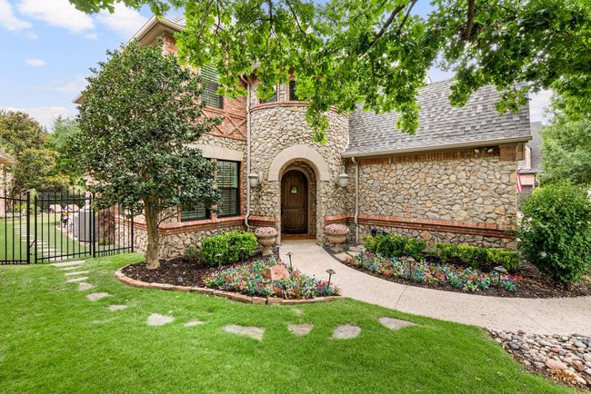 Covered front porch. Full gutters. Automatic sprinkler system. Manicured Zoysia lawn and beautiful landscaping. | Image 4