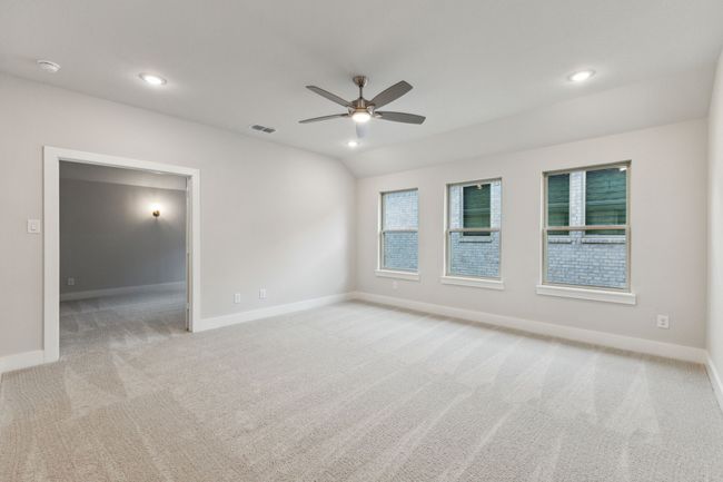 Unfurnished room featuring carpet floors, ceiling fan, a smoke detector, recessed lighting, and vaulted ceiling | Image 30