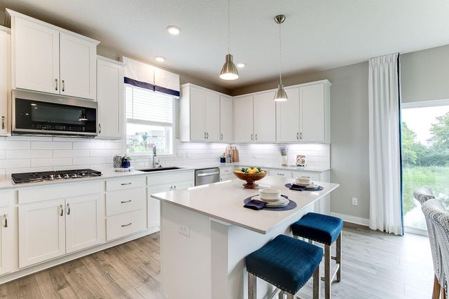 Thoughtfully-designed with a combination of functionality & modern design, this kitchen space is sure to impress. Photo of model home, color & options may vary. | Image 6