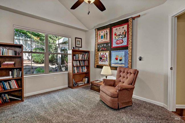 Living area featuring a ceiling fan, carpet, and vaulted ceiling | Image 10