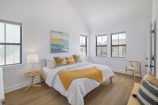 Primary bedroom with vaulted ceilings | Image 13