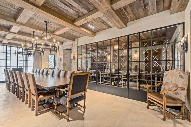 Imagine hosting a holiday, celebration, or intimate dinner party in this Tuscan-inspired dining room with adjacent wine cellar- one of two reservable dining rooms on the owners’ level. | Image 44