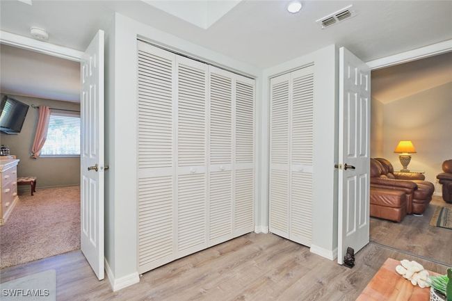 Detailed view of a smoke detector and wood finished floors | Image 24