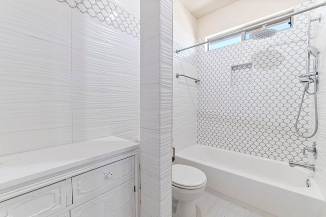 Bathroom featuring shower / tub combination | Image 34