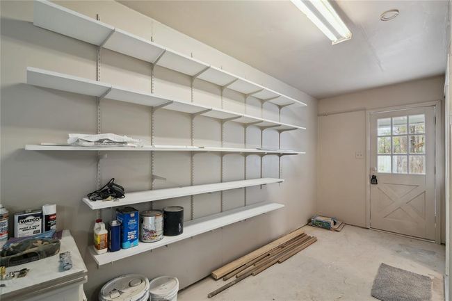 This space includes the built in storage, and is a hallway between the garage and the entrance to the house through the laundry room, which has a great direct access to the backyard. | Image 21