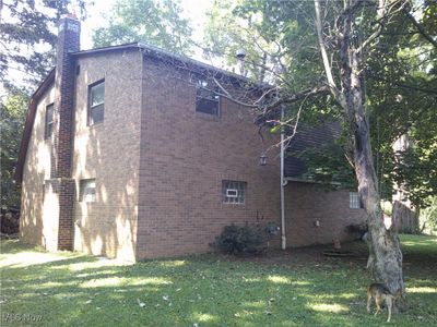 View of side of home featuring a lawn | Image 2