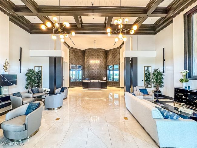 Lobby with a towering ceiling, coffered ceiling, and crown molding | Image 48