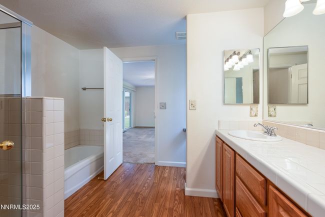 Primary bathroom shower and tub with double sinks | Image 15