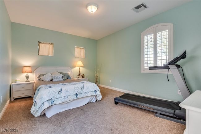 Carpeted bedroom featuring baseboards and visible vents | Image 59