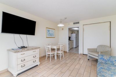 Dining space featuring light tile patterned floors | Image 3