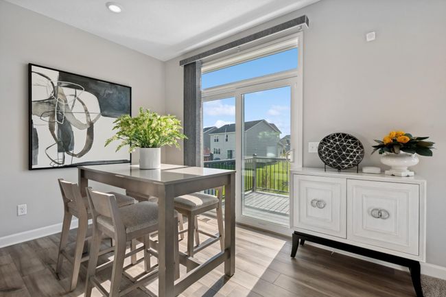 (Photo of decorated model, actual home's finishes will vary) Sliding glass doors lead to a patio for effortless indoor-outdoor living and entertaining. | Image 8