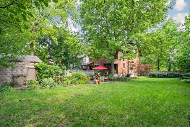 A large fenced yard or opportunity to develop awaits at this desirable property | Image 8