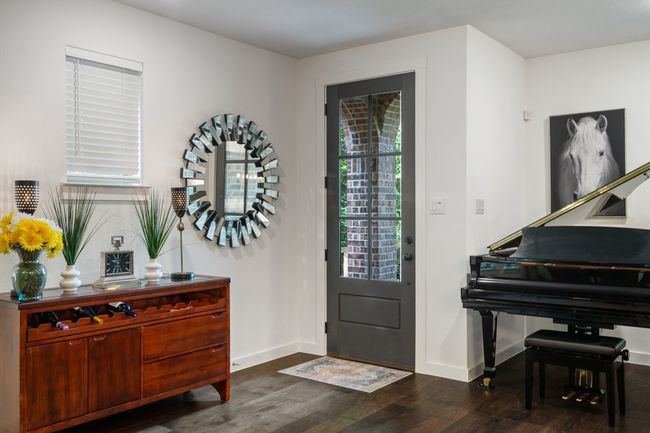Entrance foyer with dark wood finished floors and baseboards | Image 5