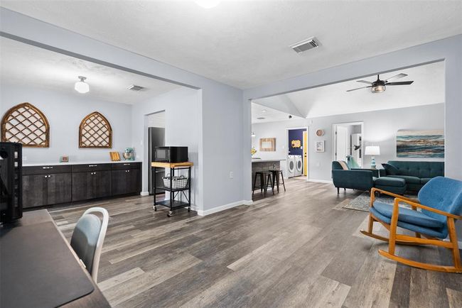 Spacious and inviting open-concept living area with modern finishes, natural light, and seamless flow between rooms—perfect for comfortable living and entertaining. | Image 10