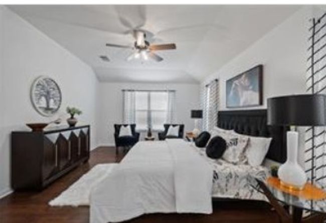 Bedroom featuring wood finished floors and ceiling fan | Image 15