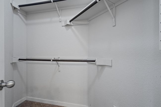 Spacious closet with carpet flooring | Image 24
