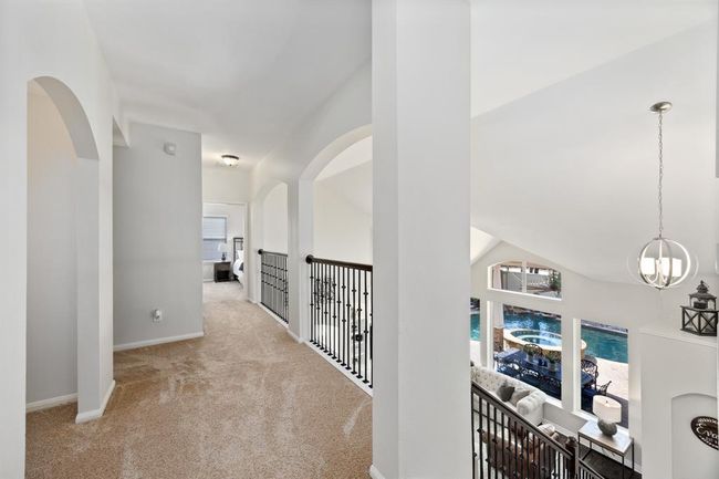 Catwalk accessing the secondary bedrooms. | Image 36