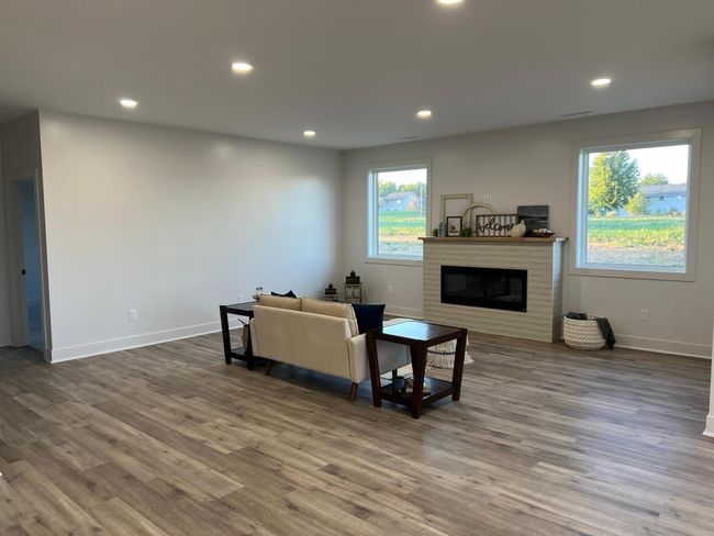 Living room with electric tiled fireplace | Image 7