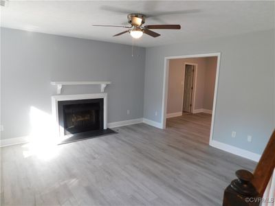 Unfurnished living room with Gas Fireplace and LVP flooring | Image 2