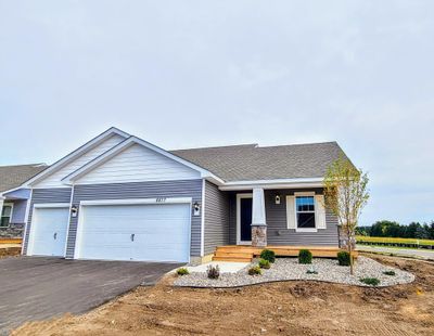 Welcome home to the Rushmore Northern Craftsman at Ravine Crossing in Cottage Grove! Photo is of actual home before landscaping. Options and colors may vary. Ask Sales Agent for details. | Image 2