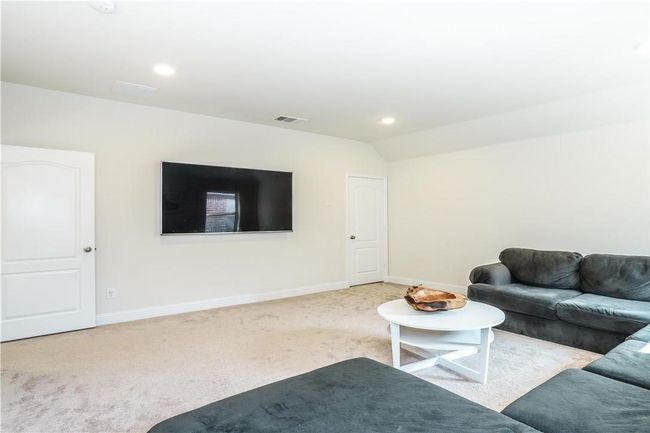 Living room featuring carpet floors, vaulted ceiling, and recessed lighting | Image 21