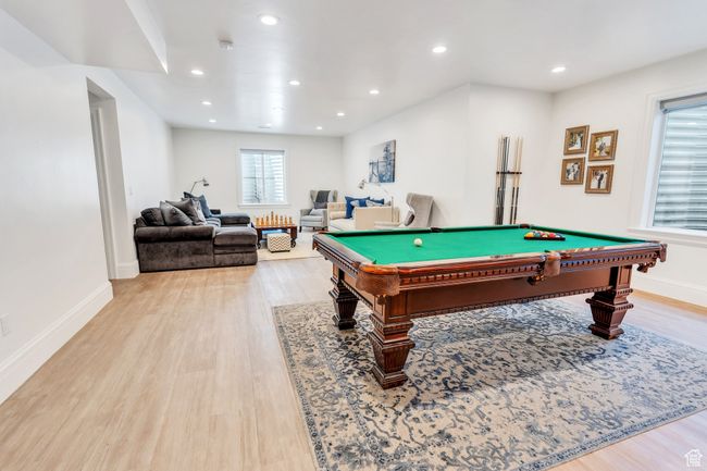 Game room with light wood-style flooring, billiards table, and recessed lighting | Image 52
