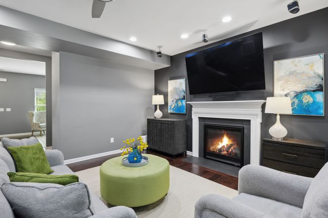 The living room is anchored by a ventless fireplace creating a nice ambiance on a snowy Winter's eve. Enjoy the surround sound while curled up in front of the fire. | Image 7