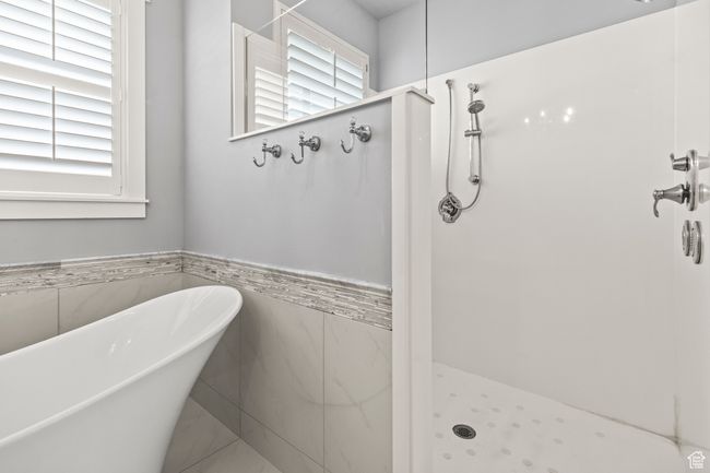 Bathroom with tile walls and plus walk in shower | Image 49