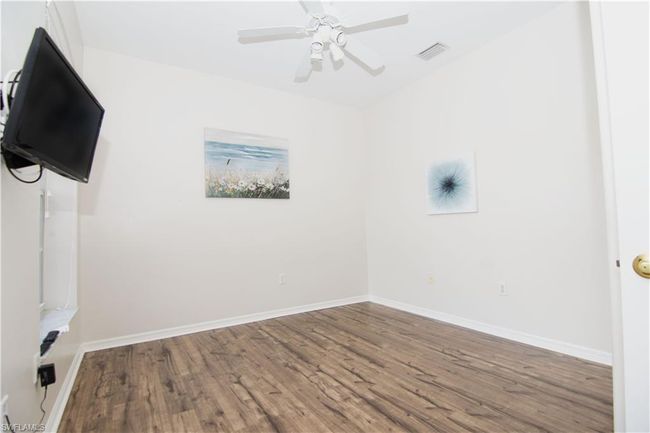 Bedroom/Den/Office features luxury vinyl plank flooring and a double closet. | Image 16