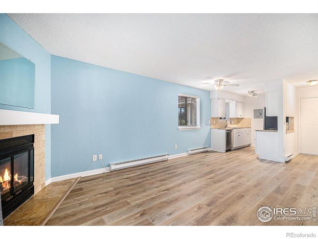 Living area and kitchen with benefit of extra window as an end unit! | Image 4