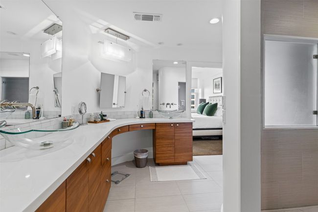 Full bathroom with recessed lighting, tile patterned floors, visible vents, vanity, and tasteful backsplash | Image 21