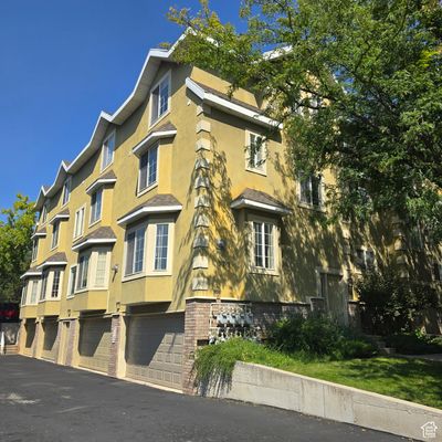 View of building exterior featuring a garage | Image 1