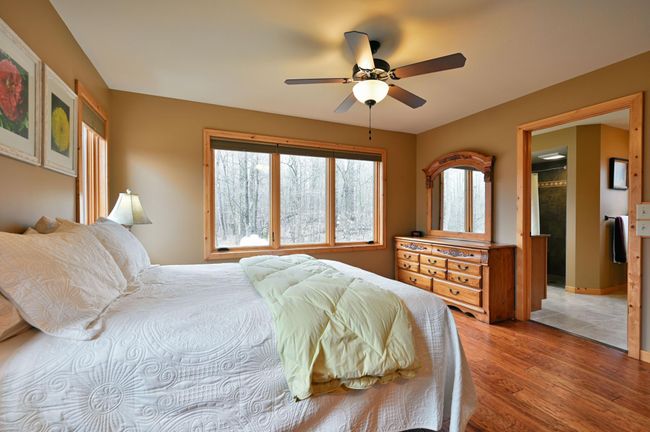 The primary bedroom from another angle, showing the entrance into the three-quarter bath. | Image 39