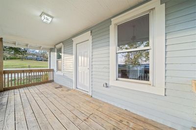 Wooden terrace featuring covered porch | Image 2