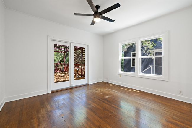 Spare room featuring plenty of natural light, baseboards, and hardwood / wood-style floors | Image 22