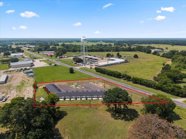 Aerial view of property and surrounding area featuring an industrial area and property parcel outlined | Image 5