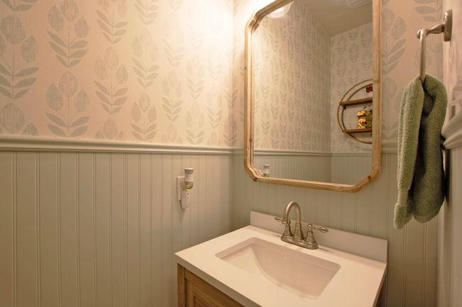 Bathroom with vanity, a wainscoted wall, and wallpapered walls | Image 25