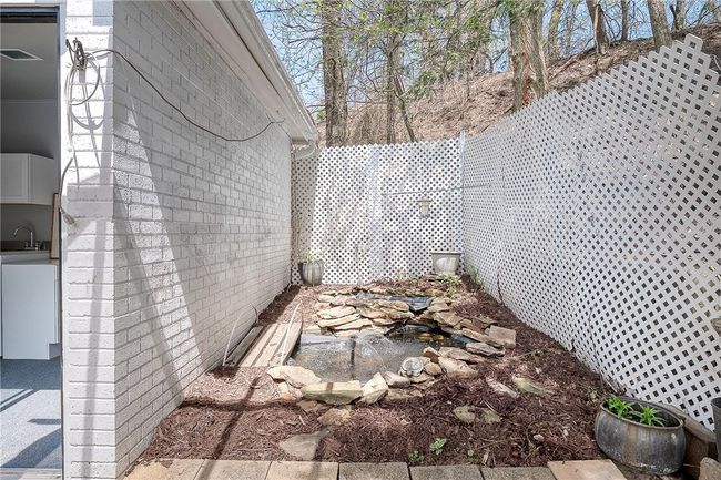 Kids can add their own goldfish to this water feature next to the pool | Image 40