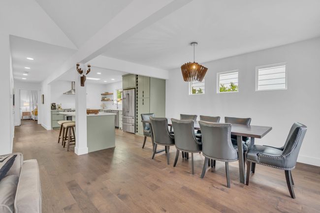 Dining room with recessed lighting and dark wood-type flooring | Image 12