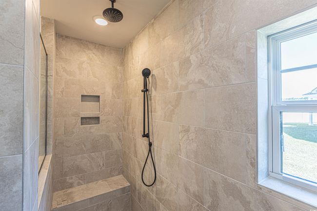 Bathroom with a tile shower | Image 16