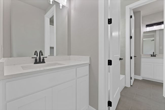 Full bathroom featuring vanity and shower / bathtub combination | Image 32
